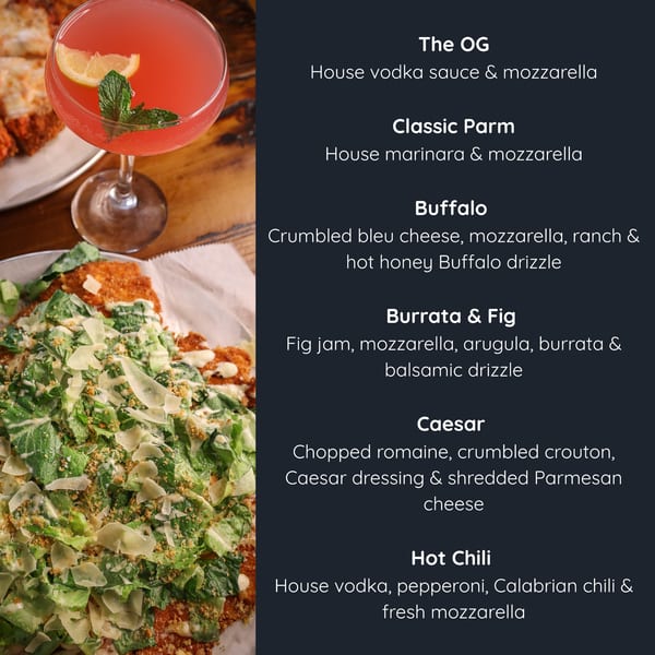 A pink cocktail with a lemon slice and mint, next to a Caesar salad with chicken cutlets.